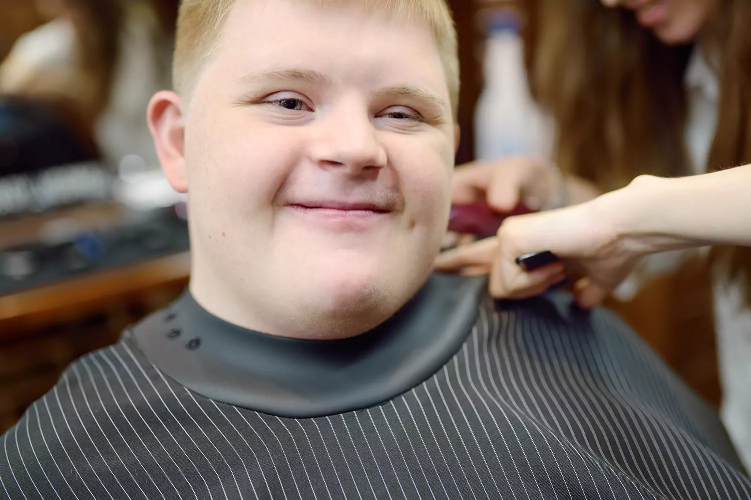 Disabled man getting a haircut